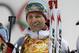 Norway's Ole Einar Bjoerndalen smiles after winning the gold during the mixed biathlon relay at the 2014 Winter Olympics, Wednesday, Feb. 19, 2014, in Krasnaya Polyana, Russia. (AP Photo/Lee Jin-man)