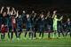 Munich players celebrate after a Champions League, round of 16, first leg soccer match between Arsenal and Bayern Munich at the Emirates stadium in London, Wednesday, Feb. 19, 2014 .(AP Photo/Alastair Grant)