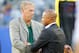 Aug 24, 2013; East Rutherford, NJ, USA; New York Jets general manager John Idzik, Jr (left) and New York Giants general manager Jerry Reese (right) exchange greetings prior to the game at MetLife Stadium. Mandatory Credit: Jim O'Connor-USA TODAY Sports