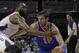 New York Knicks' Beno Udrih, right, drives past Charlotte Bobcats' Al Jefferson, left, during the second half of an NBA basketball game in Charlotte, N.C., Tuesday, Jan. 14, 2014. The Bobcats won 108-98. (AP Photo/Chuck Burton)