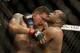 Daniel Cormier, right, fights Frank Mir during a UFC heavyweight mixed martial arts fight in San Jose, Calif., Saturday, April 20, 2013. Cormier won by unanimous decision. (AP Photo/Jeff Chiu)
