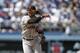 San Francisco Giants shortstop Brandon Crawford throws the ball during the eighth inning of a season-opening baseball game against the Los Angeles Dodgers in Los Angeles, Monday, April 1, 2013. (AP Photo/Jae C. Hong)