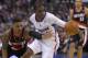 Portland Trail Blazers guard Damian Lillard, left, and Los Angeles Clippers guard Chris Paul reach for a loose ball during the second half of an NBA basketball game, Wednesday, Feb. 12, 2014, in Los Angeles. (AP Photo/Mark J. Terrill)