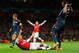 LONDON, ENGLAND - FEBRUARY 19: Jerome Boateng of Bayern Muenchen brings down Mesut Oezil of Arsenal in the area for a penalty during the UEFA Champions League Round of 16 first leg match between Arsenal and FC Bayern Muenchen at Emirates Stadium on February 19, 2014 in London, England. (Photo by Shaun Botterill/Getty Images)