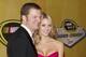 Dale Earnhardt Jr, left, and Amy Reimann arrive at the NASCAR Sprint Cup Series auto racing awards ceremony on Friday, Dec. 2, 2011, at The Wynn Las Vegas Resort in Las Vegas. (AP Photo/Eric Jamison)