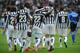 TURIN, ITALY - FEBRUARY 16: Kwadwo Asamoah (C) of Juventus celebrates after scoring the opening goal with team mates Fernando Lorente during the Serie A match between Juventus and AC Chievo Verona at Juventus Arena on February 16, 2014 in Turin, Italy. (Photo by Valerio Pennicino/Getty Images)