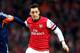 LONDON, ENGLAND - JANUARY 18: Mesut Oezil of Arsenal holds off Clint Dempsey of Fulham during the Barclays Premier League match between Arsenal and Fulham at Emirates Stadium on January 18, 2014 in London, England. (Photo by Clive Mason/Getty Images)