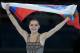 Adelina Sotnikova of Russia celebrates winning the women's free skate figure skating finals following the flower ceremony at the Iceberg Skating Palace during the 2014 Winter Olympics, Thursday, Feb. 20, 2014, in Sochi, Russia. (AP Photo/Ivan Sekretarev)