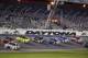 Dale Earnhardt Jr., bottom front, and Tony Stewart, top front, lead a group of cars down the front stretch during an evening practice for the Daytona 500 NASCAR Sprint Cup Series auto race at Daytona International Speedway in Daytona Beach, Fla., Wednesday, Feb. 19, 2014. (AP Photo/John Raoux)