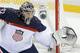 USA goaltender Jonathan Quick catches a shot on the goal during the first period of men's quarterfinal hockey game against the Czech Republic in Shayba Arena at the 2014 Winter Olympics, Wednesday, Feb. 19, 2014, in Sochi, Russia. (AP Photo/Matt Slocum)