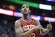 Philadelphia 76ers' Evan Turner (12) looks at the scoreboard in the second half of an NBA basketball game against the Utah Jazz Wednesday, Feb. 12, 2014, in Salt Lake City. (AP Photo/Rick Bowmer)