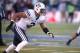 BYU's Kyle Van Noy competes in an NCAA college football game against Nevada, in Reno, Nev., on Saturday, Nov. 30, 2013. (AP Photo/Cathleen Allison)