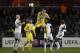 Napoli's Gokhan Inler, center, jumps for the ball as Swansea players including Jonjo Shelvey, left, and Kyle Bartley, right, look on, during their Europa League round of 32 first leg soccer match at the Liberty Stadium, Swansea, Wales, Thursday Feb. 20, 2014. (AP Photo/Jon Super)