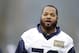 Seattle Seahawks' Michael Bennett walks on the field at an NFL football practice Thursday, Jan. 16, 2014, in Renton, Wash. The Seahawks play the San Francisco 49ers Sunday in the NFC championship game. (AP Photo/Elaine Thompson)