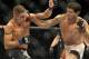 Gilbert Melendez, right, and Diego Sanchez fight in the second round of a UFC lightweight bout in Houston, Saturday, Oct. 19, 2013. Menendez won in a unanimous decision. (AP Photo/Pat Sullivan)