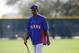 Texas Rangers manager Ron Washington watches position players during spring training baseball practice, Tuesday, Feb. 18, 2014, in Surprise, Ariz. (AP Photo/Tony Gutierrez)