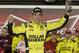 Matt Kenseth celebrates in Victory Lane after winning the first of two NASCAR Sprint Cup series qualifying auto races at Daytona International Speedway in Daytona Beach, Fla., Thursday, Feb. 20, 2014. (AP Photo/Chuck Burton)
