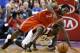 Houston Rockets' Patrick Beverley (2) and Philadelphia 76ers' Tony Wroten (8) chase down a loose ball during the second period of an NBA basketball game, Wednesday, Nov. 13, 2013, in Philadelphia. Philadelphia won 123-117 in overtime. (AP Photo/Matt Slocum)