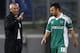 Lazio coach Edy Reja gestures to Ludogorets midfielder Svetoslav Dyakov, left, as he leaves the pitch after receiving a red card during the Europa League round of 32 first leg Europa League soccer match between Lazio and Ludogorets at Rome's Olympic stadium, Thursday, Feb. 20, 2014. (AP Photo/Riccardo De Luca)