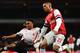 LONDON, ENGLAND - FEBRUARY 16: (L-R) Raheem Sterling of Liverpool and Kieran Gibbs of Arsenal challenge for the ball during the FA Cup Fifth Round match between Arsenal and Liverpool at the Emirates Stadium on February 16, 2014 in London, England. (Photo by Shaun Botterill/Getty Images)