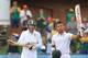 South Africa's batsman JP Duminy, right, raises his bat as teammate Wayne Parnell, left, watches after reaching a century on the second day of their 2nd cricket test match against Australia at St George's Park in Port Elizabeth, South Africa, Friday, Feb. 21, 2014. (AP Photo/ Themba Hadebe)