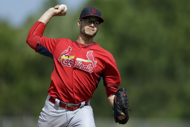 Kelly Improves Curveball by Tossing a Football