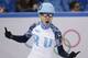 Victor An of Russia celebrates after his first place in the men's 500m short track speedskating final at the Iceberg Skating Palace during the 2014 Winter Olympics, Friday, Feb. 21, 2014, in Sochi, Russia. (AP Photo/Bernat Armangue)