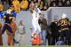Texas' Mike Davis (1) makes a catch between West Virginia's Daryl Worley (7) and Travis Bell (26) during the fourth quarter of their NCAA college football game in Morgantown, W.Va., on Saturday, Nov.9, 2013. Texas won 47-40 in overtime. (AP Photo/Christopher Jackson)