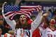 American and Canadian hockey fans cheer as Canada and the USA warm up before playing in a men's semifinal ice hockey game at the 2014 Winter Olympics, Friday, Feb. 21, 2014, in Sochi, Russia. (AP Photo/Petr David Josek)