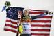 Women's slalom gold medal winner Mikaela Shiffrin of the United States poses for photographers with the U.S. flag at the Sochi 2014 Winter Olympics, Friday, Feb. 21, 2014, in Krasnaya Polyana, Russia.(AP Photo/Gero Breloer)