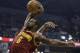 Cleveland Cavaliers' Earl Clark (6) goes in for a dunk during the first half of an NBA basketball game against the Indiana Pacers Tuesday, Dec. 31, 2013, in Indianapolis. (AP Photo/Darron Cummings)