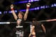 Sara McMann celebrates her win over Sheila Gaff after their UFC 159 Mixed Martial Arts bout in Newark, NJ, Saturday, April 27,2013. McMann won via first round TKO. (AP Photo/Gregory Payan)