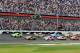 Feb 24, 2013; Daytona Beach, FL, USA; NASCAR Sprint Cup Series driver Danica Patrick (10) and Jeff Gordon (24) lead the field to the green flag at the start of the 2013 Daytona 500 at Daytona International Speedway. Mandatory Credit: Sam Sharpe-USA TODAY Sports