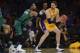 Feb 21, 2014; Los Angeles, CA, USA; Los Angeles Lakers center Pau Gasol (16) holds the ball as Boston Celtics center Jared Sullinger (7) defends during the first quarter at Staples Center. Mandatory Credit: Kelvin Kuo-USA TODAY Sports