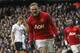 Manchester United's Wayne Rooney celebrates his penalty goal against Tottenham Hotspur during their English Premier League soccer match at White Hart Lane, London, Sunday, Dec. 1, 2013. (AP Photo/Sang Tan)