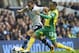 Tottenham Hotspur's Andros Townsend, left, fights for the ball with Norwich City's Nathan Redmond during their English Premier League soccer match at White Hart Lane stadium, London, Saturday, Sept. 14, 2013. (AP Photo/Bogdan Maran)