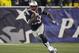 New England Patriots running back LeGarrette Blount carries the ball during the second half of an AFC divisional NFL playoff football game against the Indianapolis Colts in Foxborough, Mass., Saturday, Jan. 11, 2014. (AP Photo/Matt Slocum)
