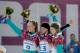 SOCHI, RUSSIA - FEBRUARY 22: Gold medalist Julia Dujmovits (C) of Austria celebrates with silver medalist Anke Karstens (L) of Germany and bronze medalist Amelie Kober (R) of Germany in the Snowboard Ladies' Parallel Slalom Big Final on day 15 of the 2014 Winter Olympics at Rosa Khutor Extreme Park on February 22, 2014 in Sochi, Russia. (Photo by Adam Pretty/Getty Images)