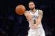 Feb 6, 2014; Brooklyn, NY, USA; Brooklyn Nets point guard Deron Williams (8) makes a pass against the San Antonio Spurs during the first half at Barclays Center. Mandatory Credit: Joe Camporeale-USA TODAY Sports
