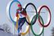 Russia's gold medal winner Alexander Legkov skis past the Olympic rings during the men's 50K cross-country race at the 2014 Winter Olympics, Sunday, Feb. 23, 2014, in Krasnaya Polyana, Russia. (AP Photo/Dmitry Lovetsky)
