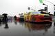 AJ Allmendinger's car (22) and others remain parked on pit road due to a rain delay before the start of the Daytona 500 auto race at Daytona International Speedway in Daytona Beach, Fla., Sunday, Feb. 26, 2012. (AP Photo/John Raoux)