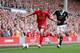 LIVERPOOL, ENGLAND - SEPTEMBER 21: Lucas of Liverpool in action with Adam Lallana of Southampton during the Barclays Premier League match between Liverpool and Southampton at Anfield on September 21, 2013 in Liverpool, England. (Photo by Clive Brunskill/Getty Images)