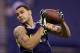 Texas A&M wide receiver Mike Evans makes a catch as he runs a drill at the NFL football scouting combine in Indianapolis, Sunday, Feb. 23, 2014. (AP Photo/Michael Conroy)