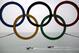 Russian Coast Guard vessels patrol the Black Sea past the Olympic rings hanging outside a train station near the 2014 Winter Olympics, Saturday, Feb. 22, 2014, in Adler, Russia. (AP Photo/David Goldman)