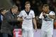 Schalke head coach Jens Keller, left, speaks to Schalke's scorer Leon Goretzka and Kevin-Prince Boateng of Ghana, from left, during the German Bundesliga soccer match between Bayer Leverkusen and FC Schalke 04 in Leverkusen, Germany, Saturday, Feb. 15, 2014. (AP Photo/Martin Meissner)