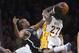 Los Angeles Lakers forward Jordan Hill, right, tries to put up a shot as Brooklyn Nets center Jason Collins blocks it during the first half of an NBA basketball, Sunday, Feb. 23, 2014, in Los Angeles. (AP Photo/Mark J. Terrill)