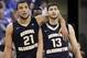 George Washington's Kevin Larsen, left, and teammate Patricio Garino pause during the second half of an NCAA college basketball game against Saint Louis Saturday, Feb. 22, 2014, in St. Louis. Saint Louis won 66-59. (AP Photo/Whitney Curtis)