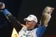 Randy Howell, Springville, Ala., holds up two bass at a weigh-in, Sunday Feb. 23, 2014 in Birmingham, Ala. that helped him win the Bassmaster Classic on Lake Guntersville. (AP Photo/Hal Yeager)