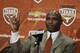 AUSTIN, TX - JANUARY 6: The University of Texas Longhorns new head football coach Charlie Strong from Louisville flashes the 'Hook 'Em Horns' sign after being introduced during a press conference January 6, 2014 at Darrell K. Royal-Texas Memorial Stadium in Austin, Texas. (Photo by Erich Schlegel/Getty Images)