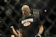 Feb 22, 2014; Las Vegas, NV, USA; Patrick Cummins walks out of the octagon after being defeated by Daniel Cormier (red gloves) after their UFC light heavyweight bout at Mandalay Bay. Cormier won by way of a TKO in the first round. Mandatory Credit: Stephen R. Sylvanie-USA TODAY Sports